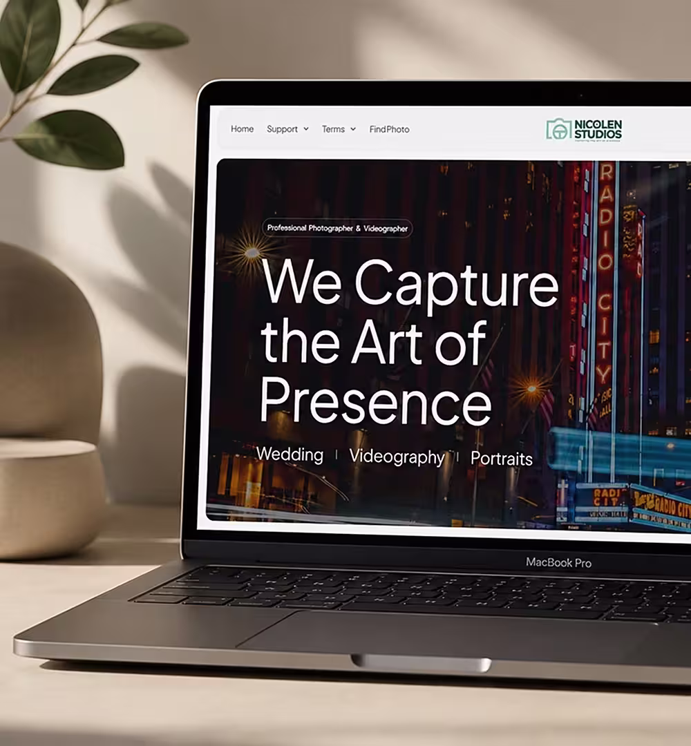 Commerce 1 - BeeTcore Nicolen Studios website on a laptop, with the headline We Capture the Art of Presence